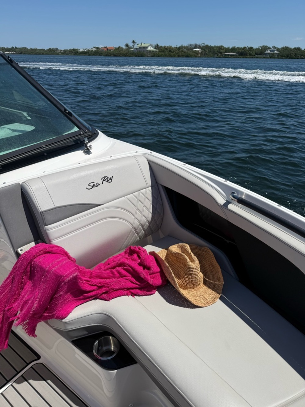 Sea Ray Boat Seat with Hot Pink Cover-Up and Straw Hat